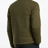 Green jacket worn by a person, showing the jacket fit