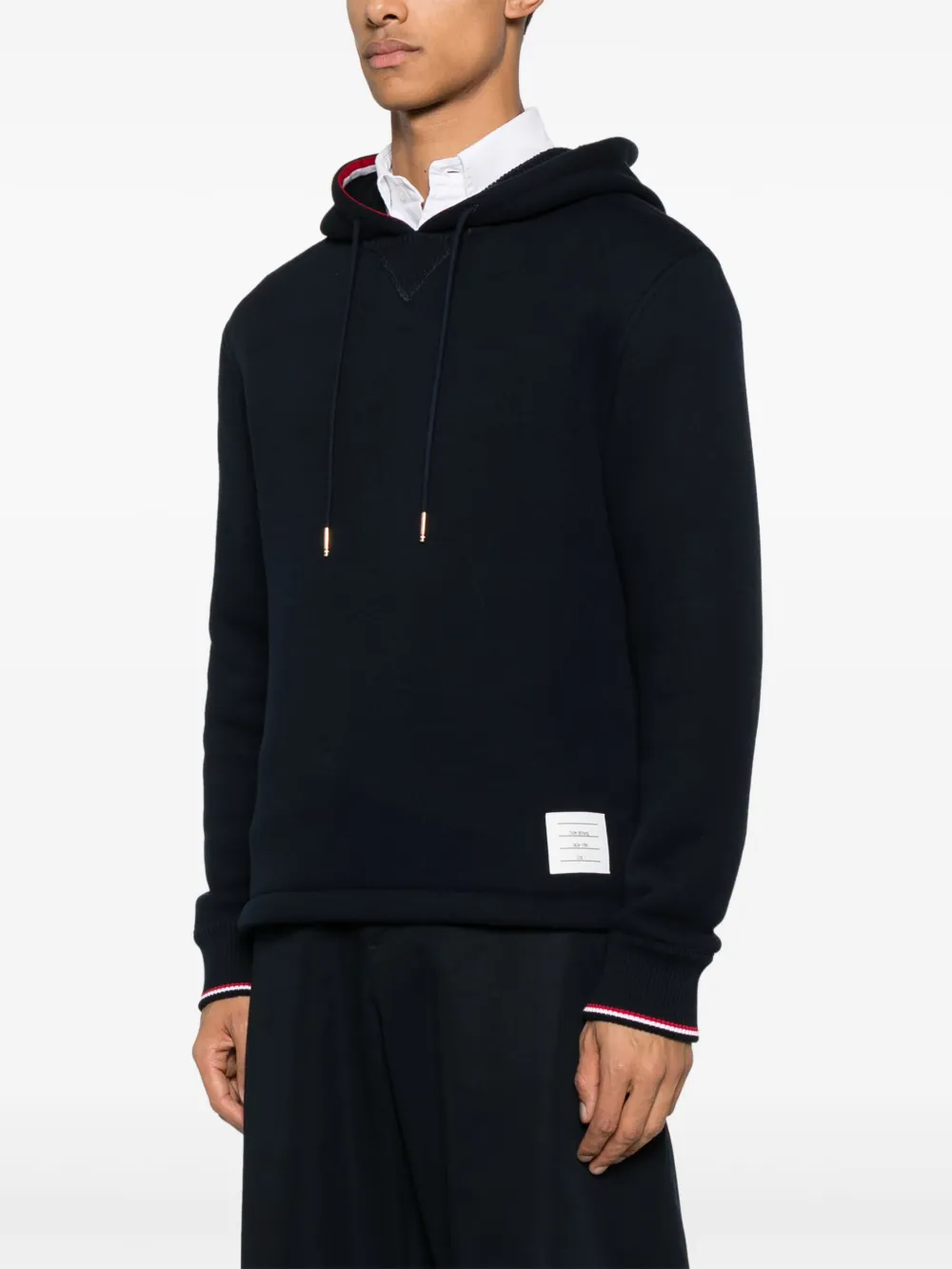Navy hoodies worn by a person, showing the hoodies fit