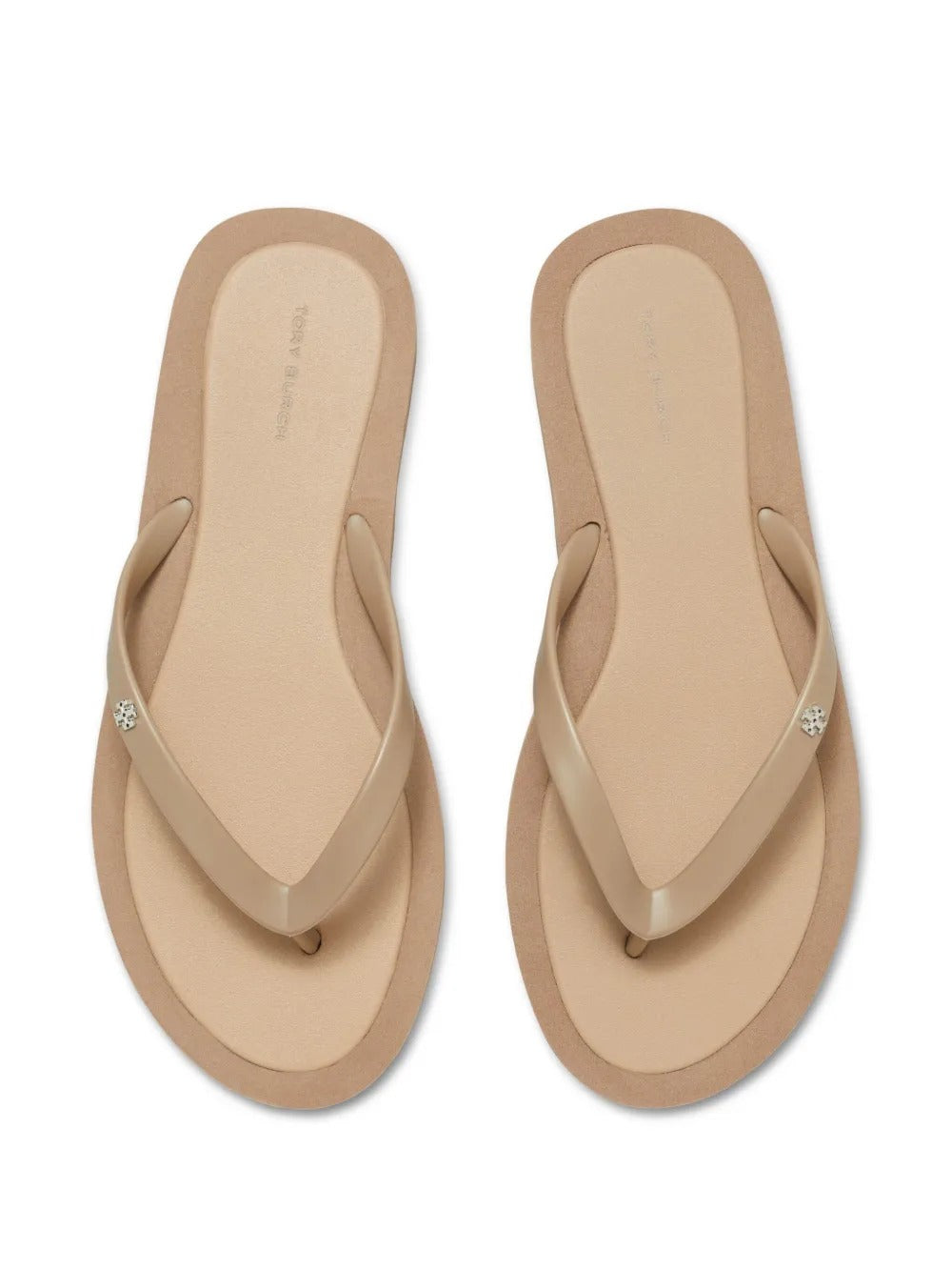 Close up of tan sandals, showing texture of the thermoplastic polyurethane and polyethylene vinyl acetate fabric