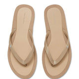 Close up of tan sandals, showing texture of the thermoplastic polyurethane and polyethylene vinyl acetate fabric