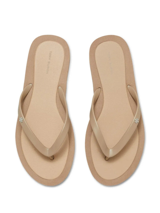 Close up of tan sandals, showing texture of the thermoplastic polyurethane and polyethylene vinyl acetate fabric