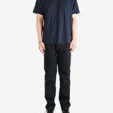 Navy t-shirt worn by a person, showing the t-shirt's fit