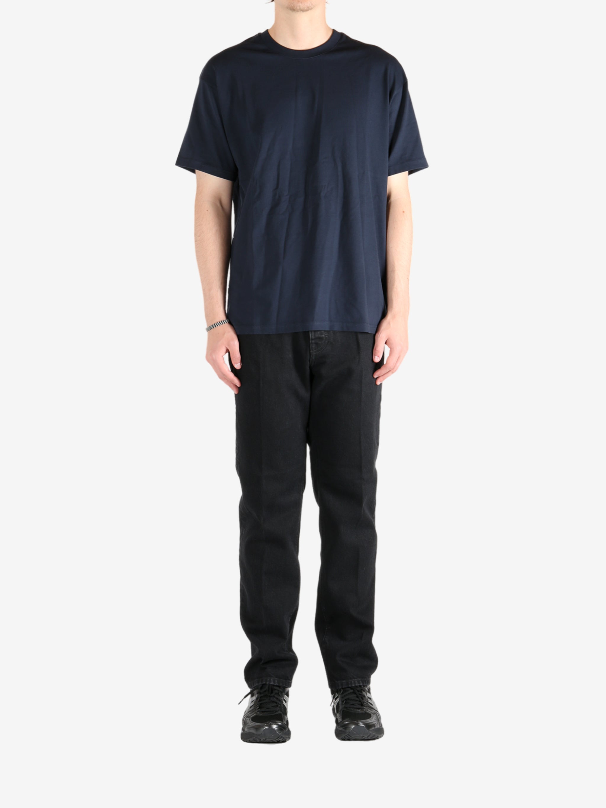 Navy t-shirt worn by a person, showing the t-shirt's fit