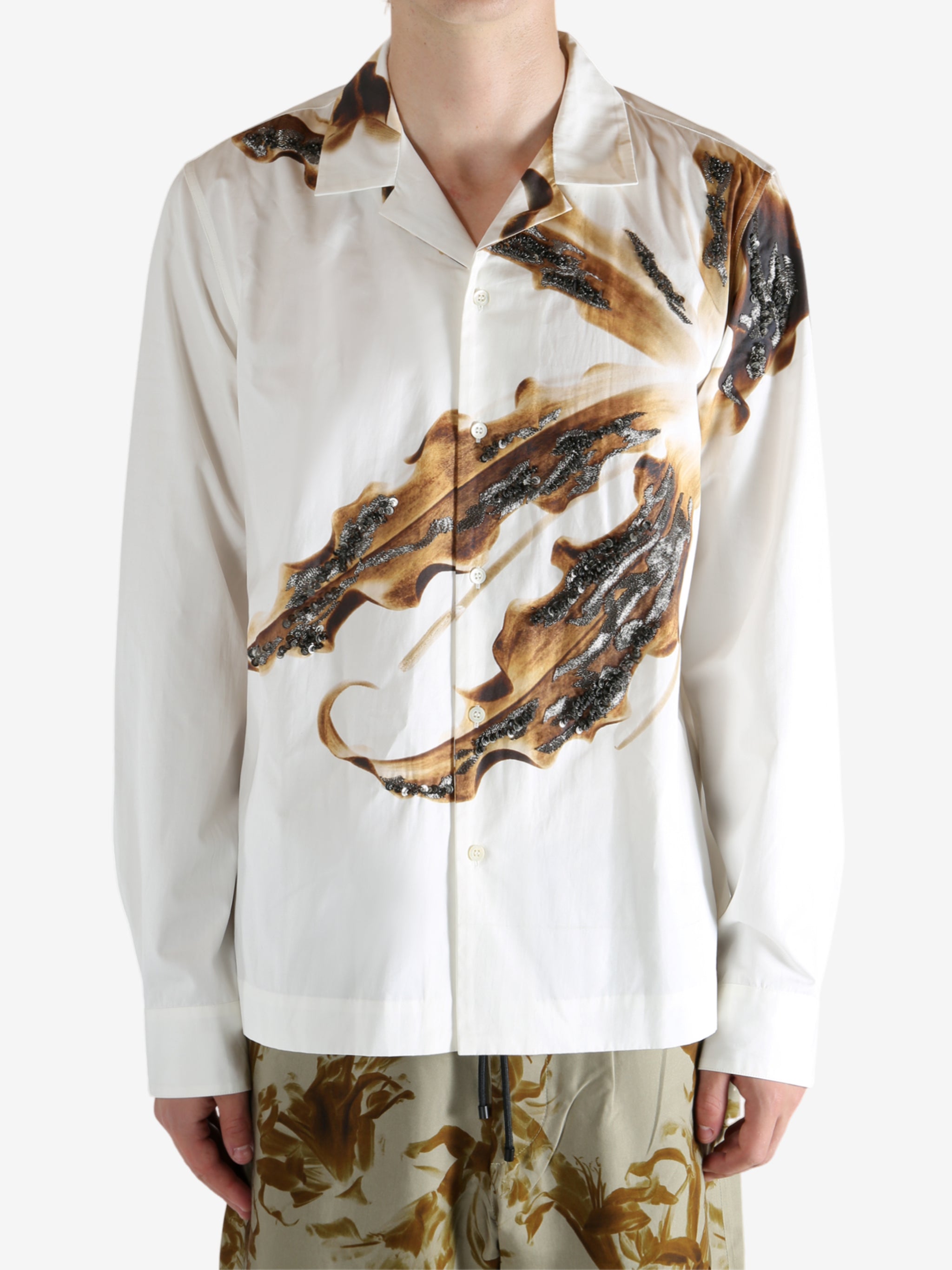 White shirt worn by a person, showing the shirt's fit