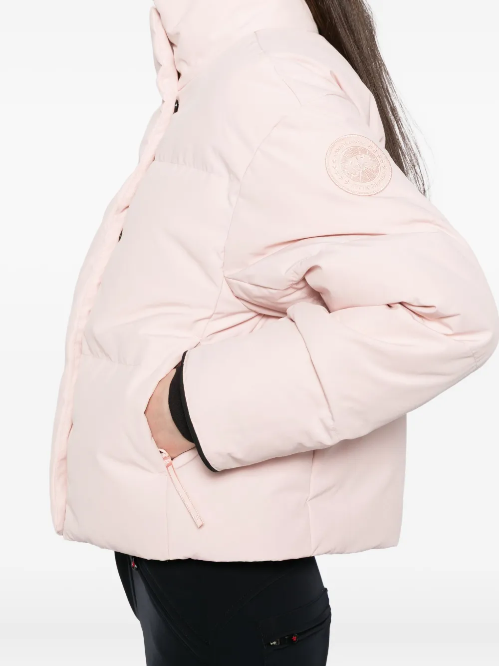 Close up of pink jackets-coats, showing texture of the polymide fabric