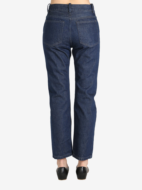 Dark blue pants worn by a person, showing the pants's fit