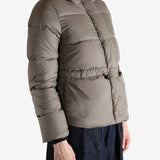 Grey jacket worn by a person, showing the jacket's fit
