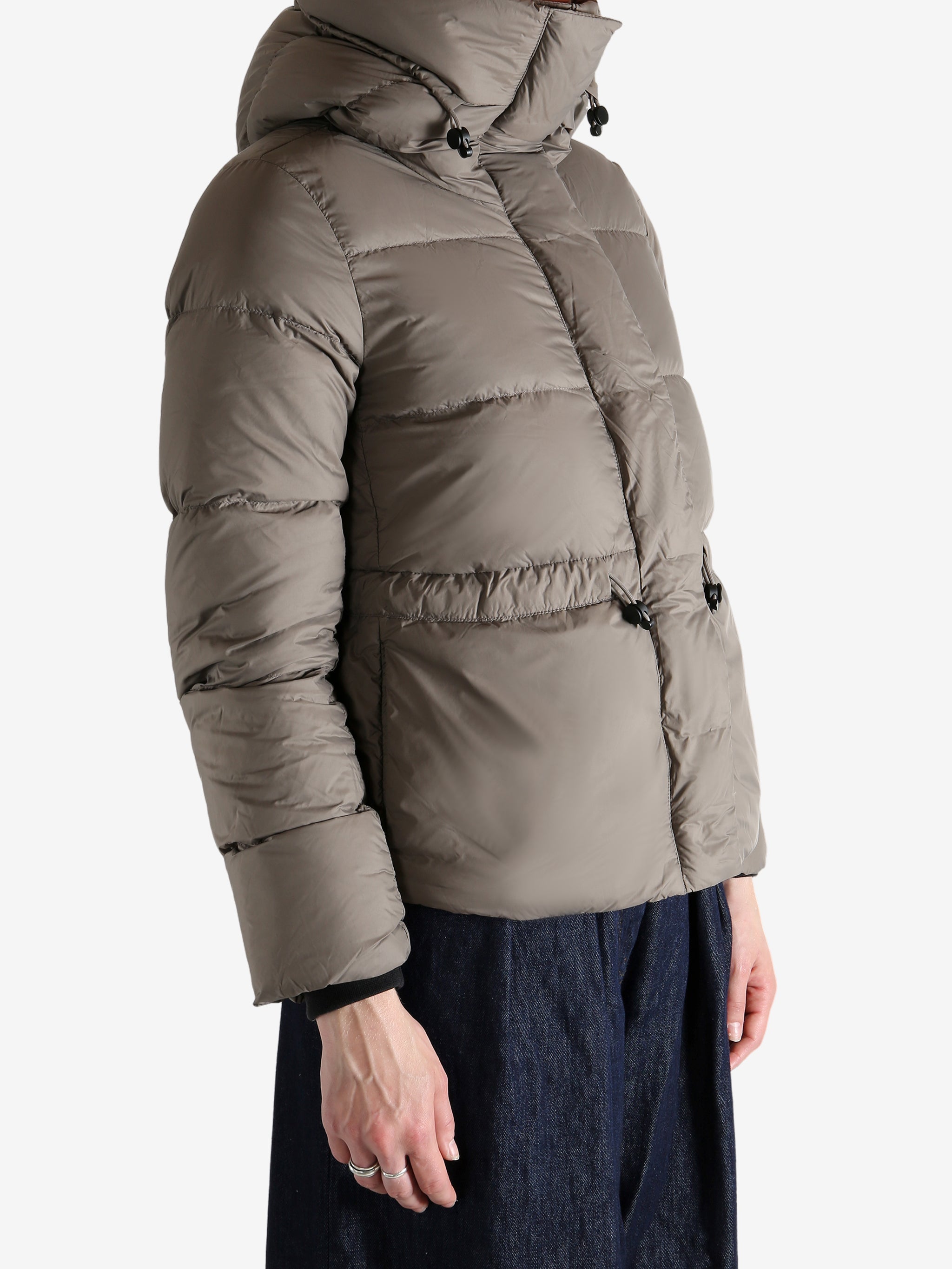 Grey jacket worn by a person, showing the jacket's fit
