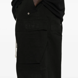 Close up of the black pants, showing texture of the cotton fabric