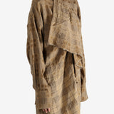 Brown top worn by a person, showing the top fit