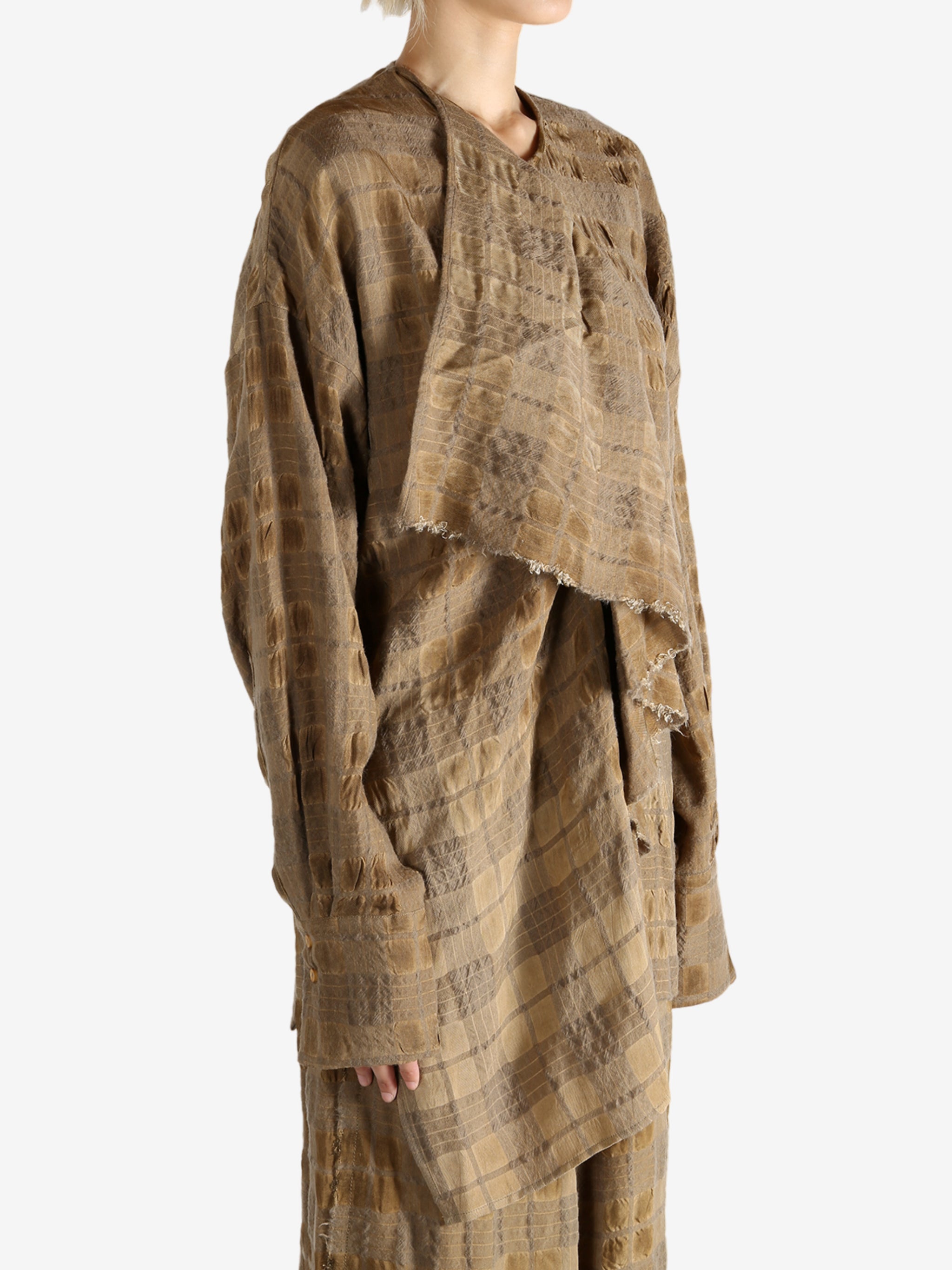 Brown top worn by a person, showing the top fit