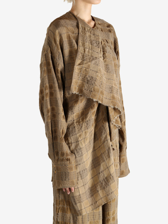 Brown top worn by a person, showing the top fit