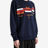 Navy knitwear worn by a person, showing the knitwear fit