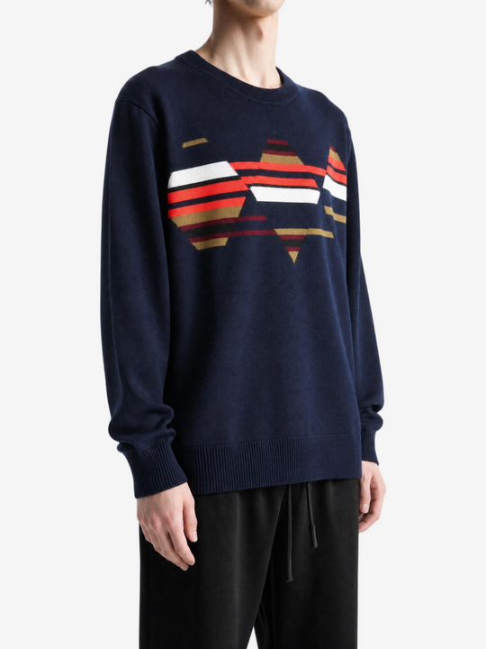 Navy knitwear worn by a person, showing the knitwear fit