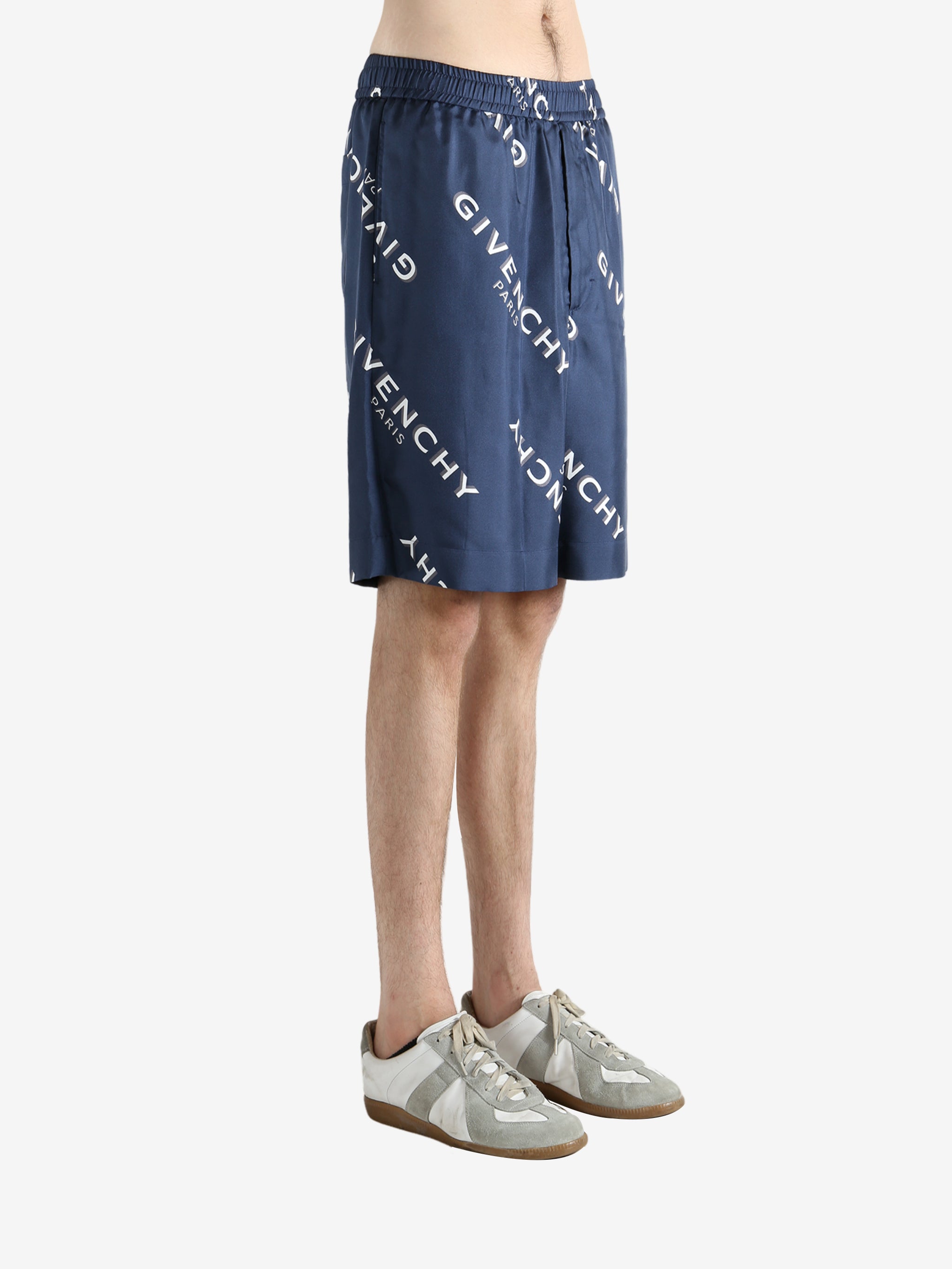 Navy short worn by a person, showing the short fit