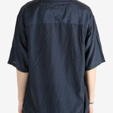 Blue shirt worn by a person, showing the shirt's fit