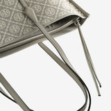 Close up of the grey bag, showing texture of the leather fabric
