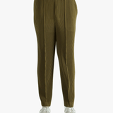 Green pants worn by a person, showing the pants' fit