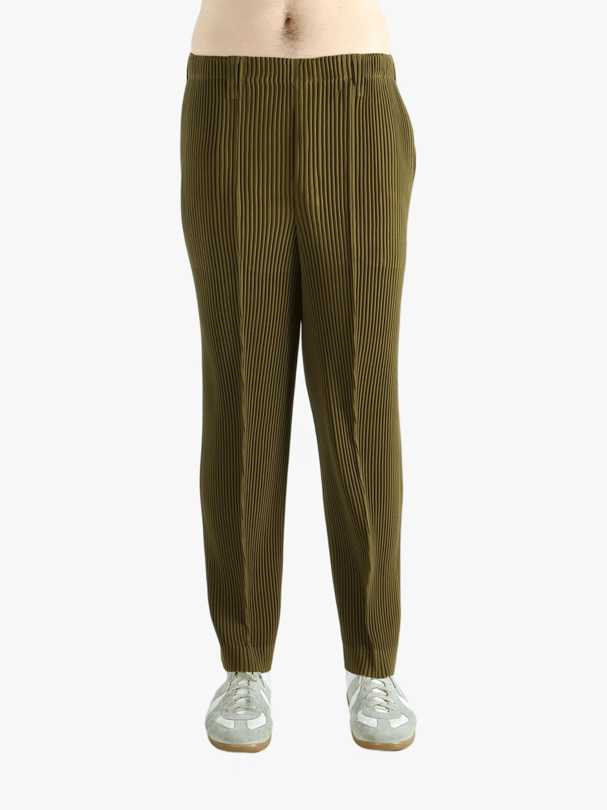 Green pants worn by a person, showing the pants' fit