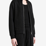 Black hoodie worn by a person, showing the hoodie fit