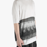 White t-shirt worn by a person, showing the t-shirt's fit