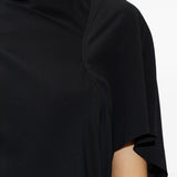 Close up of black dresses, showing texture of the silk and acetate fabric