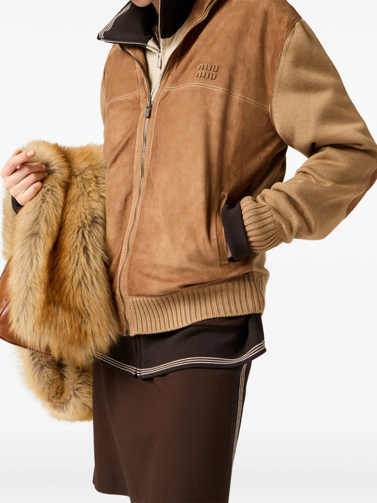 Brown jacket  worn by a person, showing the jacket 's fit