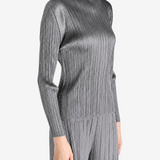 Grey shirt worn by a person, showing the shirt fit