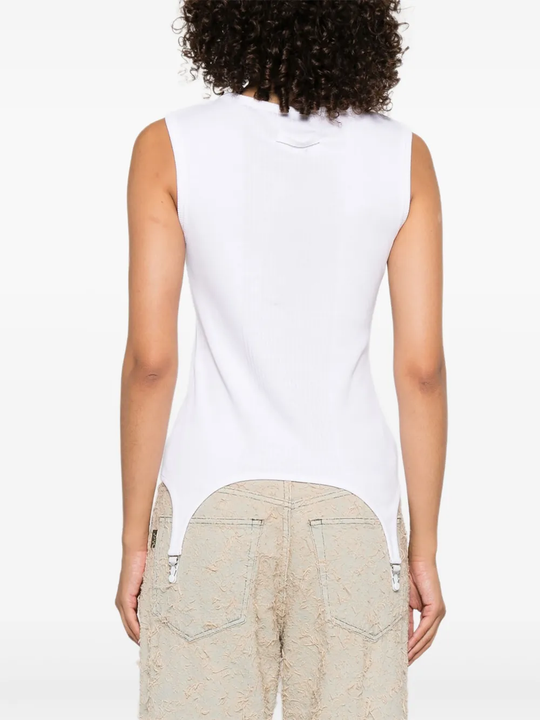 White top worn by a person, showing the top's fit