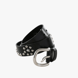 Close up of black small  accessories, showing texture of the leather fabric