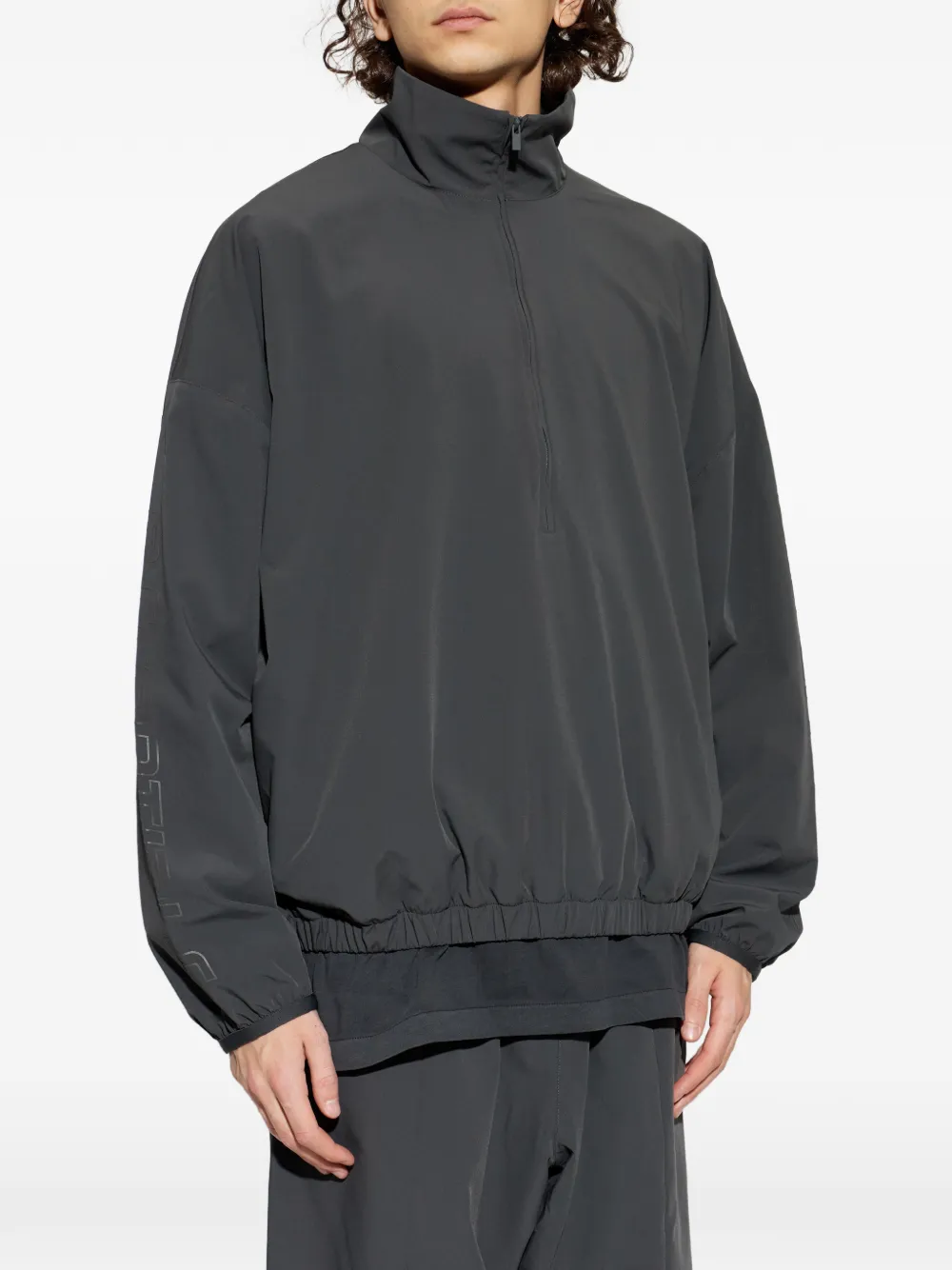 grey jacket worn by a person, showing the  jacket fit