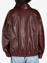 Burgundy jacket worn by a person, showing the jacket's fit