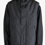 Black top worn by a person, showing the top's fit