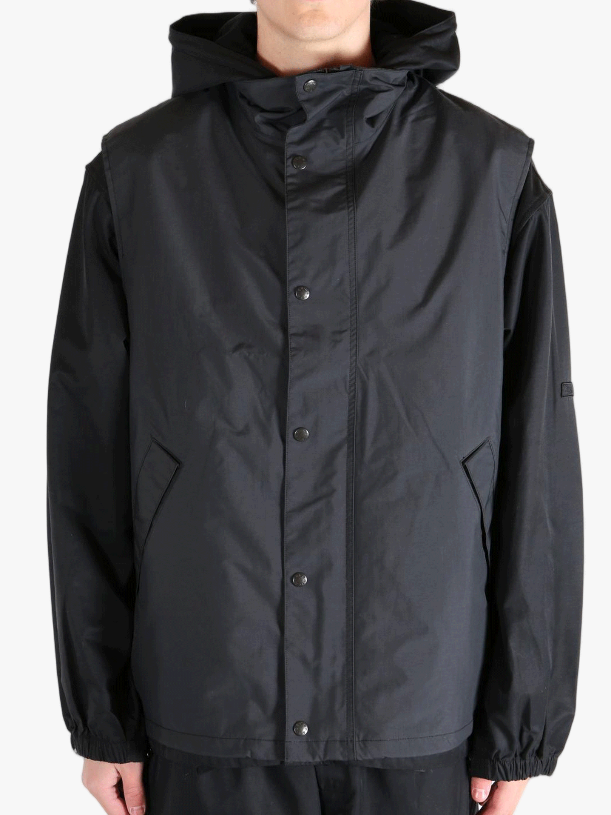 Black top worn by a person, showing the top's fit