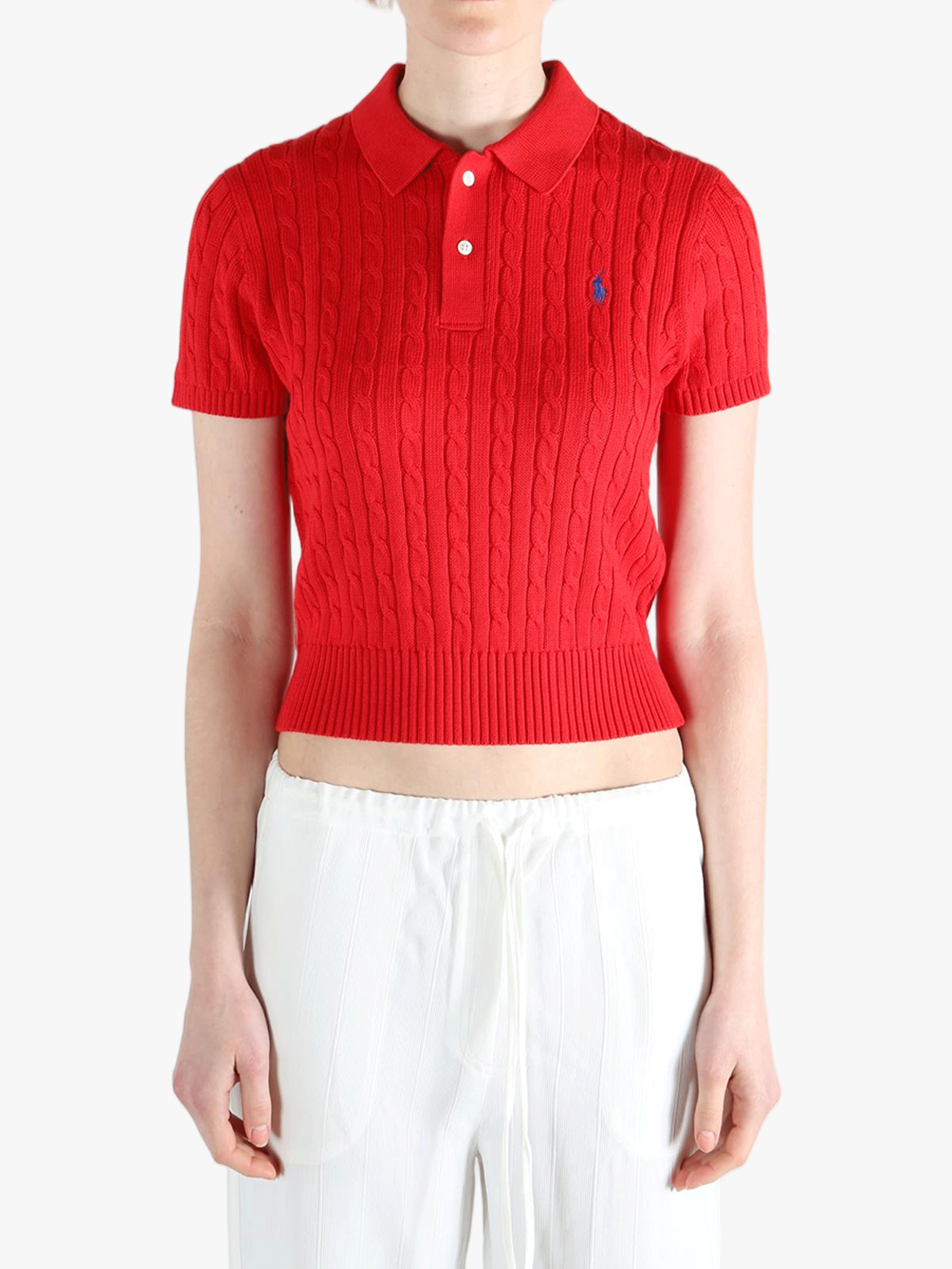 Red knitwear, worn by a person, showing the knitwear's fit