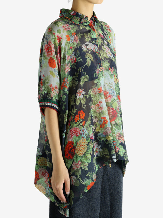 Green top worn by a person, showing the top fit