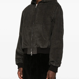 Brown jackets worn by a person, showing the jackets fit