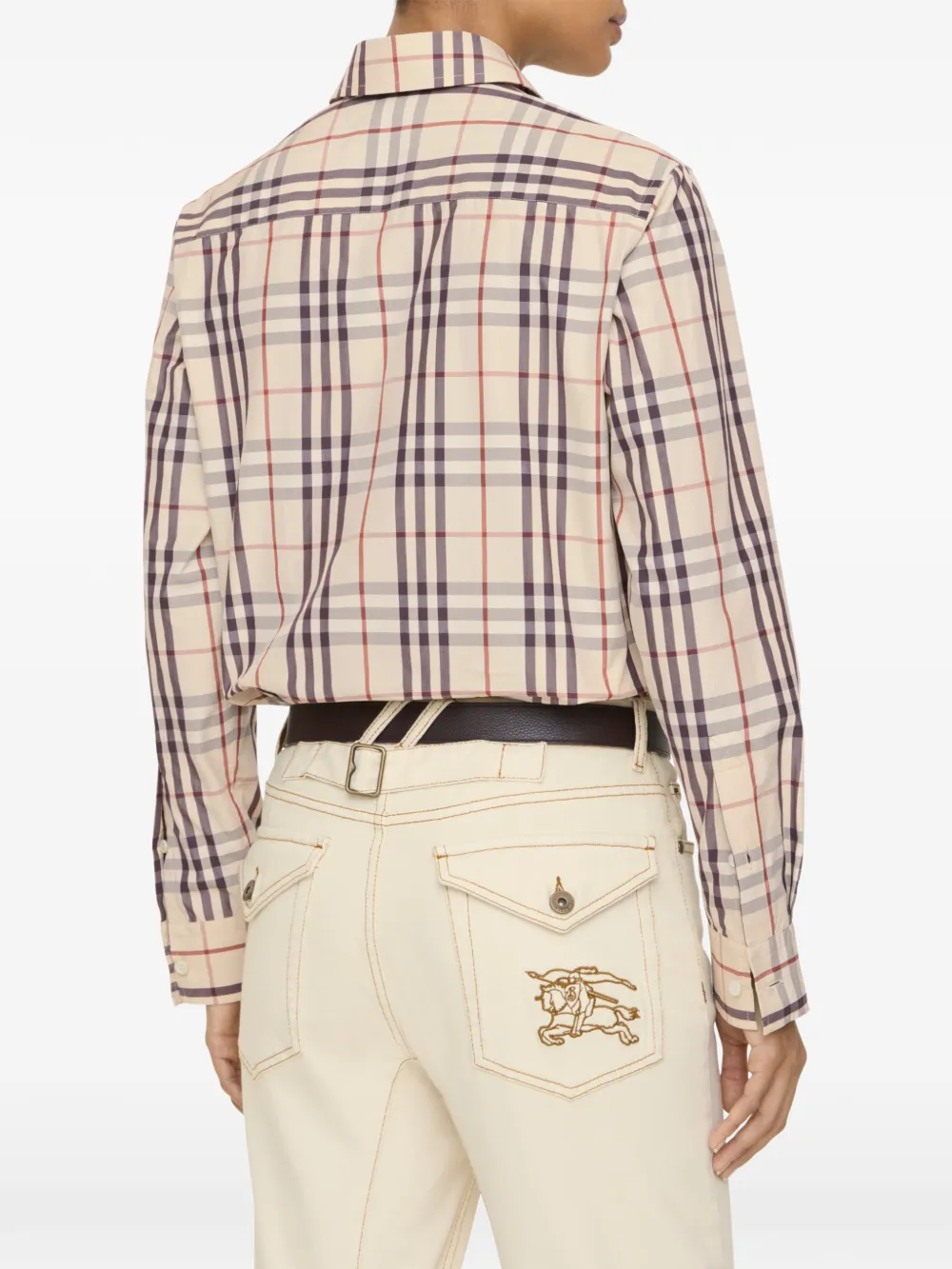 Tan shirts worn by a person, showing the shirts fit