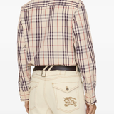 Tan shirts worn by a person, showing the shirts fit