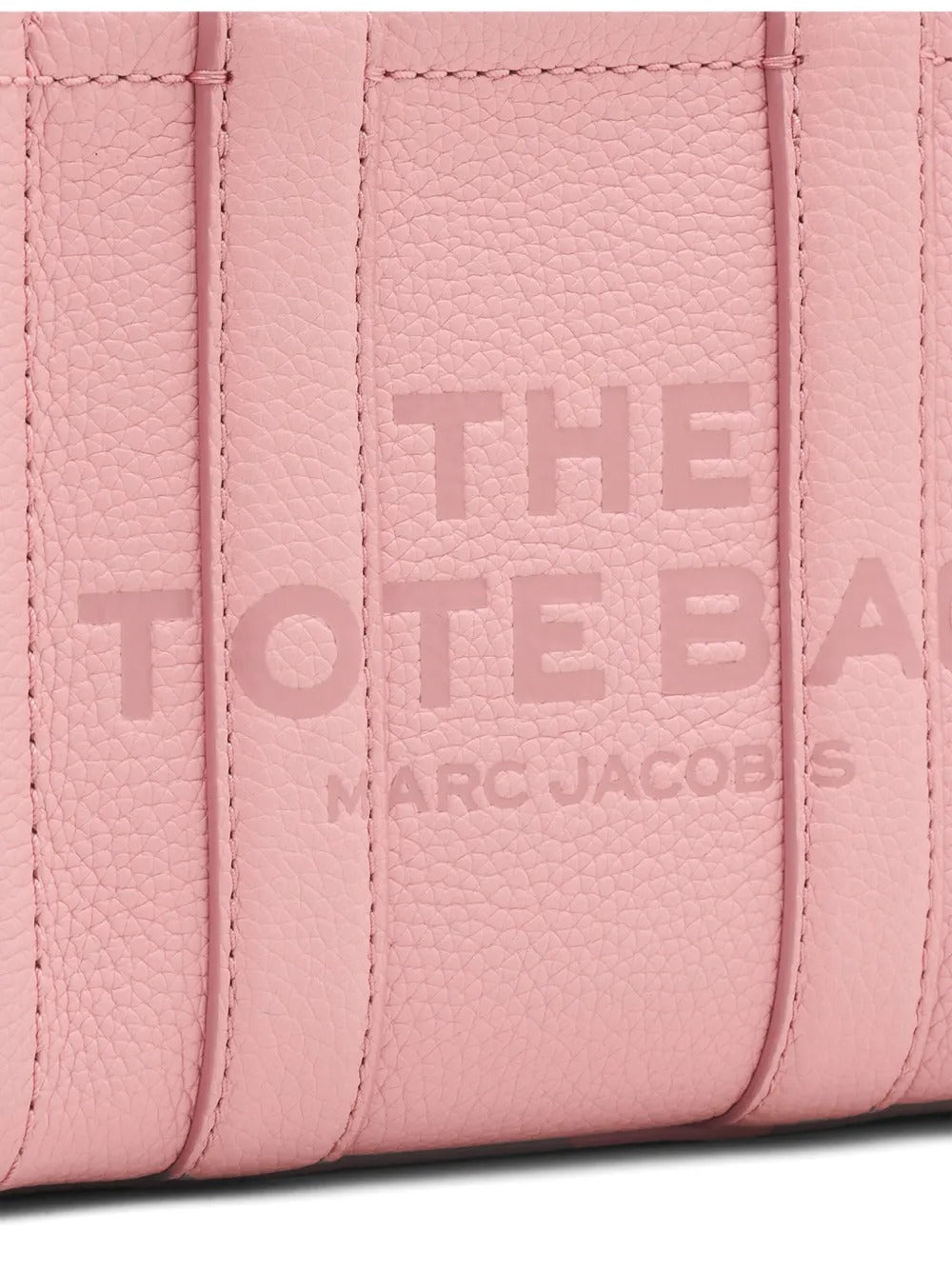 Close up of pink bag, showing texture of the leather fabric