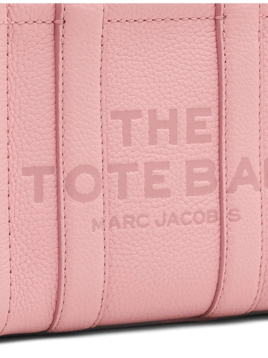 Close up of pink bag, showing texture of the leather fabric
