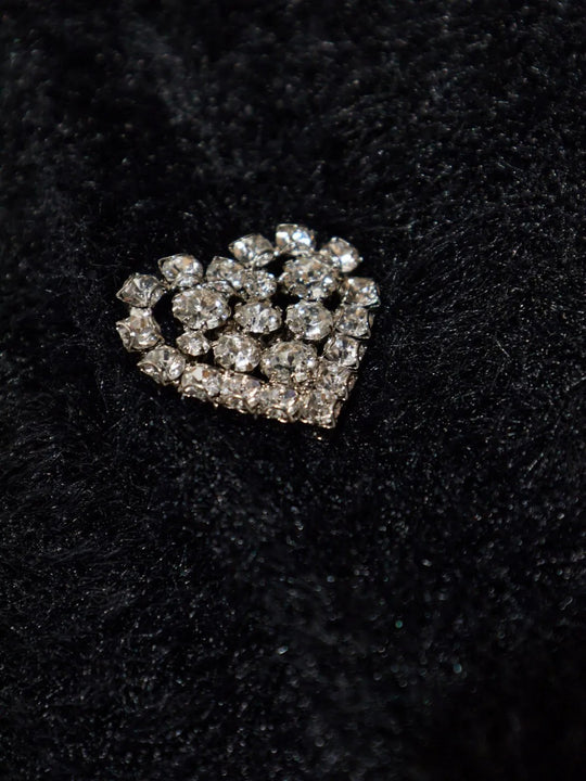 Close up of black knitwear, showing texture of the polyamide fabric