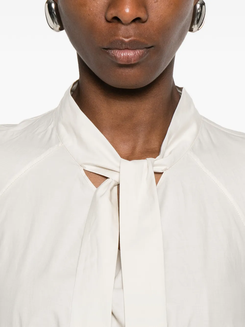 Close up of white shirts, showing texture of the cotton and silk fabric
