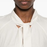 Close up of white shirts, showing texture of the cotton and silk fabric