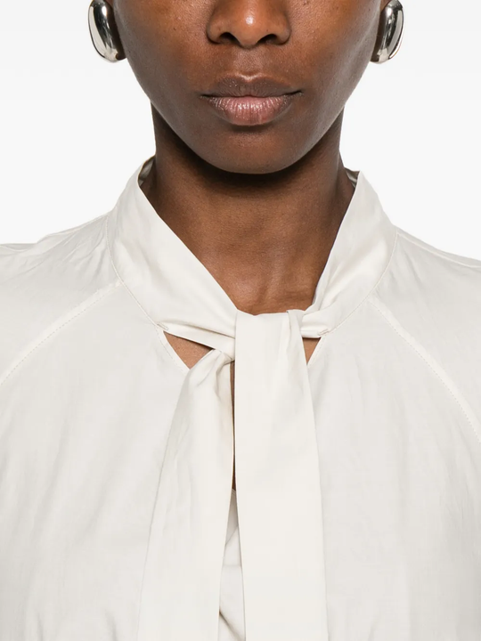 Close up of white shirts, showing texture of the cotton and silk fabric