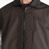 Brown jacket worn by a person, showing the jacket fit