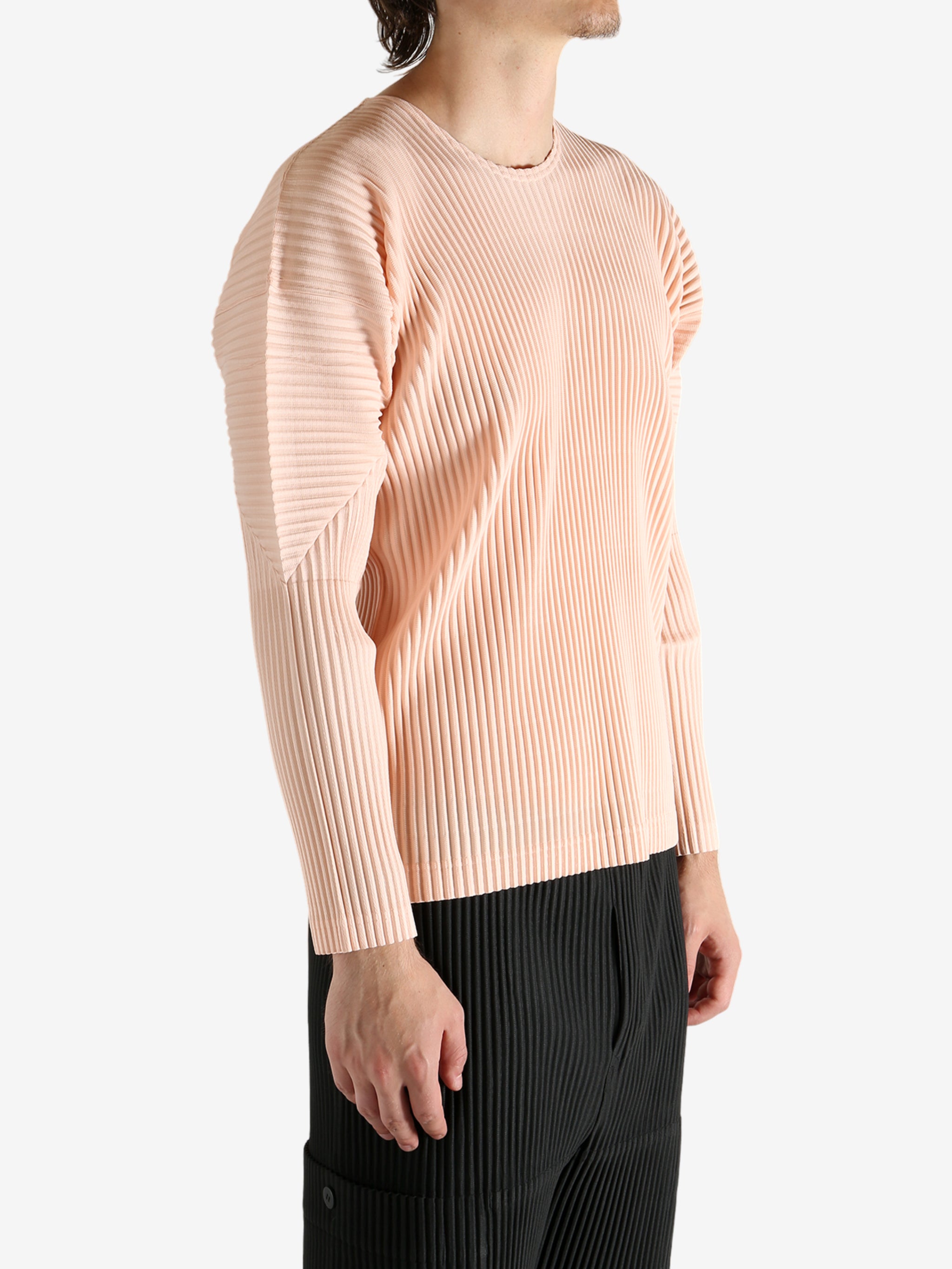 Pink shirts worn by a person, showing the shirt's fit