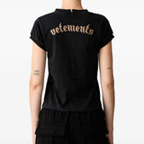 Black t-shirt worn by a person, showing the t-shirt fit