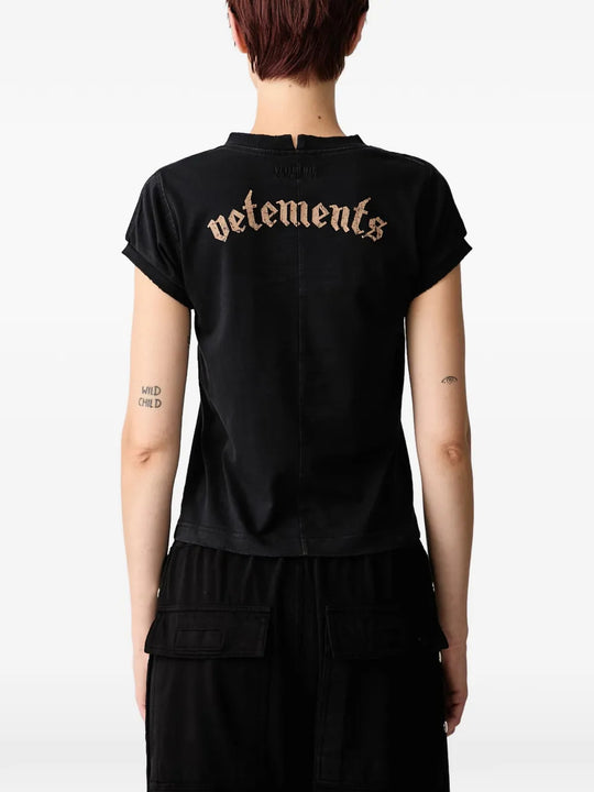 Black t-shirt worn by a person, showing the t-shirt fit