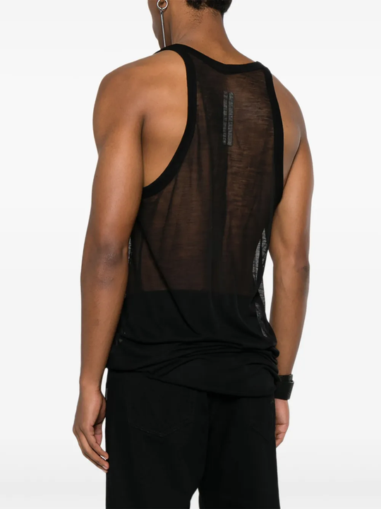 Black top worn by a person, showing the top fit